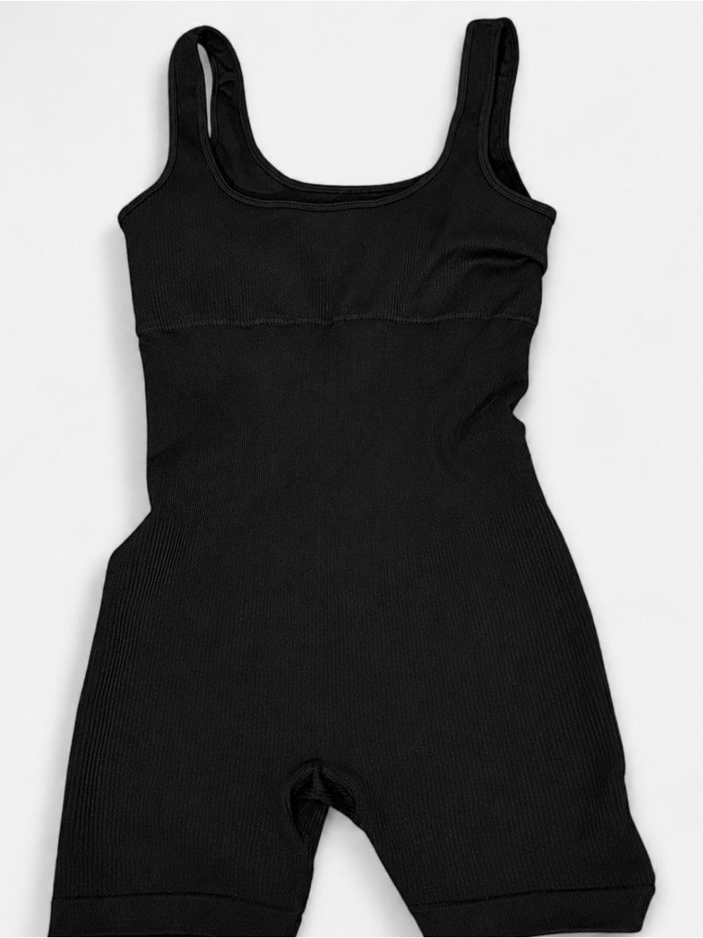 BLACK seamless shaping romper with a sculpting